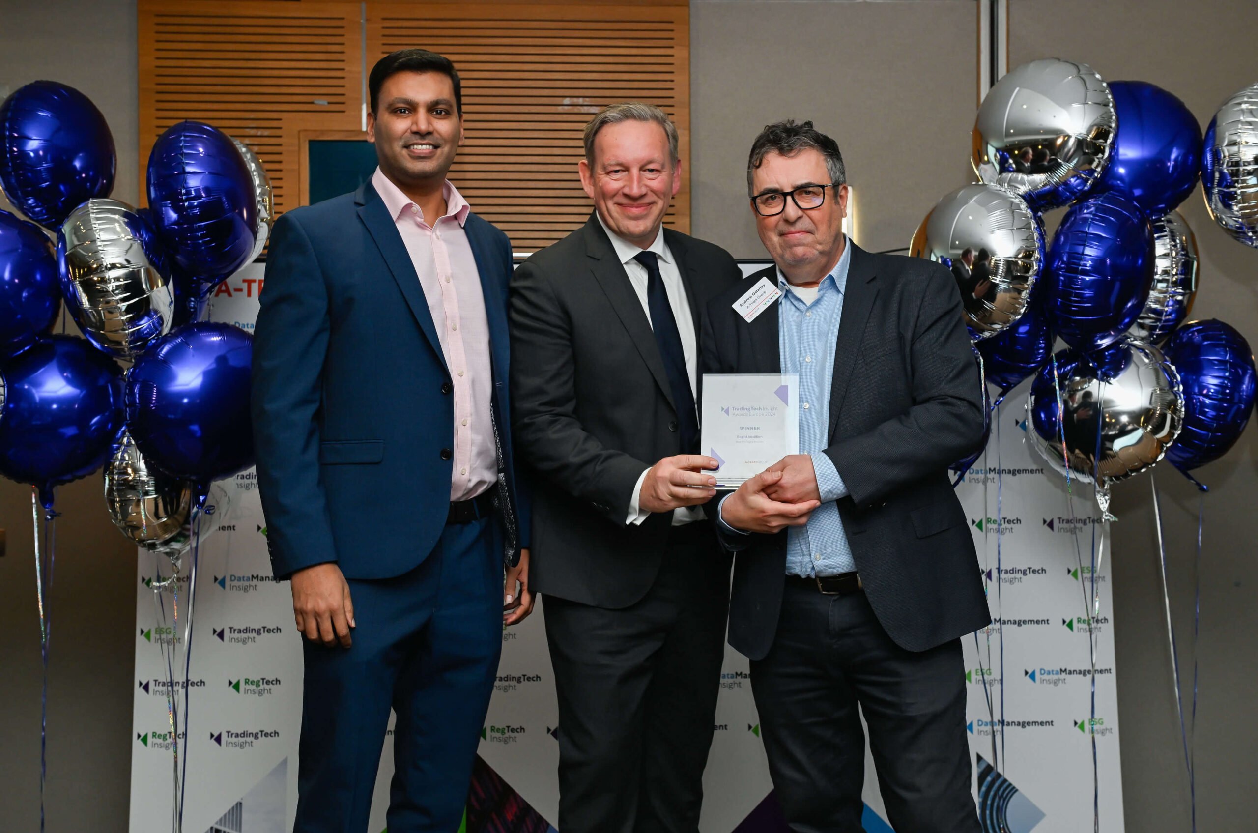 Rapid Addition CEO Mike Powell and CTO Deepak Dhayatker accepting the award for Best FIX Engine Provider from Andrew Delaney founder of A-Team